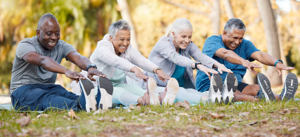 Older adults stretching together outdoors
